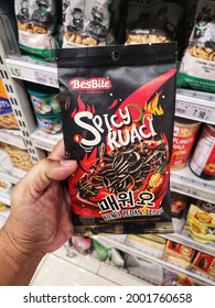 Subang Jaya, Malaysia - 18 June 2021 : Hand Hold A Packet Of BESBITE Spicy Roasted Sunflower Seed For Sell In The Supermarket With Selective Focus. 