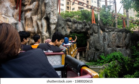 Subang Jaya, Malaysia - November 28, 2019: Tourist Riding A Rollercoaster At Sunway Lagoon Theme Park In Bandar Sunway. The View From The Seat Inside The Rollercoaster. Outdoor Activities.