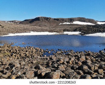 Subarctic Desert. Little Unnamed Lake On Putorana Plateau. Altitude Is About 1200 Meters Above Sea Level. 