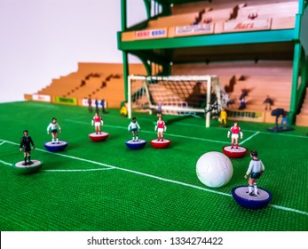 Subbuteo Football Figures In Action In Front Of The Goal On A Grass Field, Tottenham V Arsenal