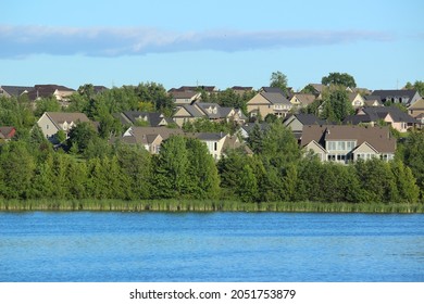 Subdivision Homes Across A Lake 