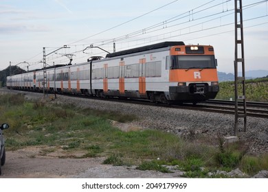 Subirats (Barcelona, Spain). 04-29-2015. Commuter Train Crossing The Vineyards Of Penedès