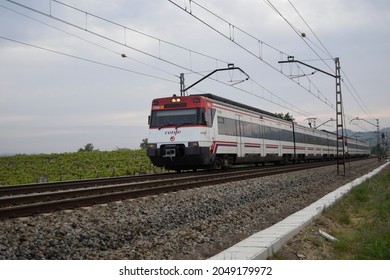 Subirats (Barcelona, Spain). 04-29-2015. Commuter Train Crossing The Vineyards Of Penedès