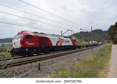 Subirats (Barcelona, Spain). 04-29-2015.  Freight Train Crossing The Vineyards Of Penedès