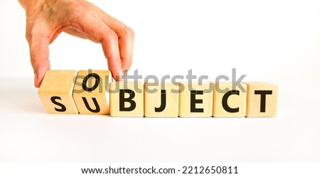 Subject and object symbol. Businessman turns a cube, changes the word subject to object. Beautiful white table, white background. Business, subject and object concept. Copy space.