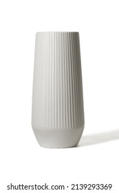 Subject shot of a grey ceramic glossy vase decorated with a glaze. The designer vase with serrated relief surface is isolated on the white background. - Shutterstock ID 2139293369