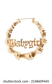 Subject Shot Of A Massive Gold Hoop Earring With A Textured Caption 