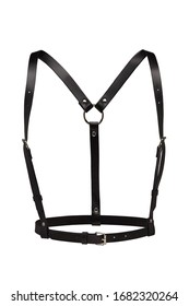 Subject shot of a simple black leather harness made of straps with rivets, steel rings and buckles. The chest harness is isolated on the white background.  