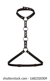 Subject shot of a simple black leather harness made of straps with rivets, steel rings, buckles and studs. The simple harness is isolated on the white background.  