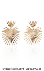 Subject shot of two big gold earrings with spikes. The pair of earrings is isolated on the white background. - Shutterstock ID 2141240365