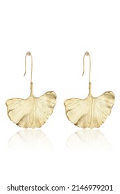 Subject shot of two gold dangle earrings shaped as leaves with textured surface. The pair of earrings is isolated on the white background. - Shutterstock ID 2146979201