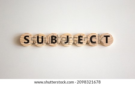 Subject symbol. The concept word Subject on wooden circles. Beautiful white background, copy space. Business and subject concept.