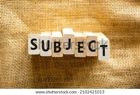 Subject symbol. The concept word Subject on wooden blocks. Beautiful canvas background, copy space. Business and subject concept.