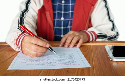 Subject and Verb Agreement worksheet on wooden table in class - Shutterstock ID 2176423793
