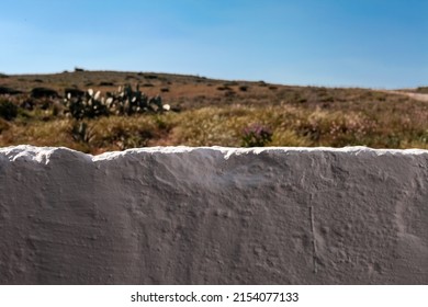 Subjective View Of A White Stone Fence From A House