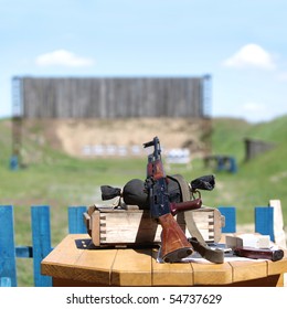 Submachine Gun On Shooting Range. Soft Focus