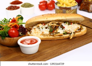 Submarine baguette chicken sandwich with melted cheese, vegetable and french fries