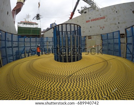 Submarine cable loading to freighter vessel