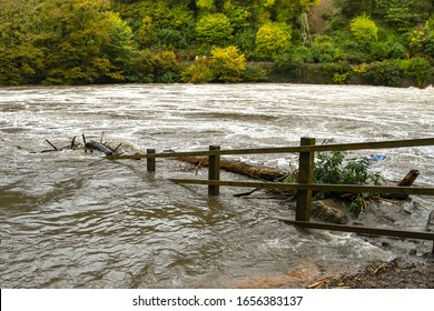 Submerged wooden fence on a river in heavy flood after a storm - Shutterstock ID 1656383137