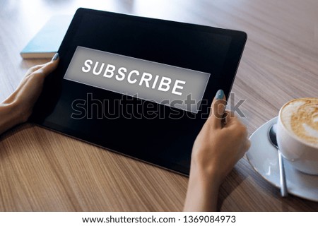 Subscribe button on device screen. Internet and digital marketing concept.