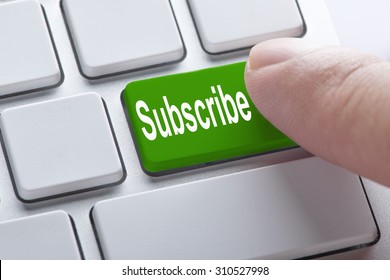 Subscribe green button on keyboard, business concept
