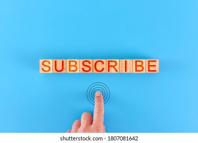 subscribe. man presses the button next to the inscription subscribe - Powered by Shutterstock