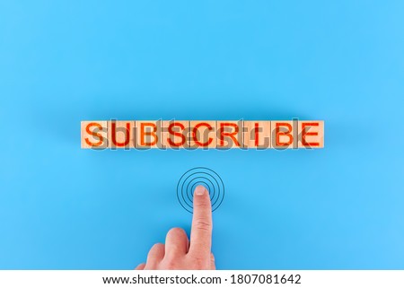 subscribe. man presses the button next to the inscription subscribe