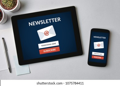 Subscribe newsletter concept on tablet and smartphone screen over gray table. All screen content is designed by me. Flat lay - Shutterstock ID 1075784411