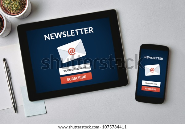 Subscribe\
newsletter concept on tablet and smartphone screen over gray table.\
All screen content is designed by me. Flat\
lay