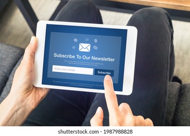 Subscribe to newsletter form on tablet computer screen to join list of susbscribers and receive exclusive offers and update. Digital communication marketing and email advertising. Membership sign-up