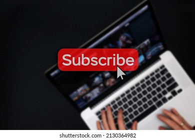 Subscribe now. Online video subscription red button. Internet service on laptop digital tablet blured technology background. Streaming video. Communication network - Powered by Shutterstock - Get 15% off with code: PIKWIZARD15
