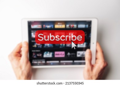 Subscription plan. Red online video subscribe button. Internet service on laptop digital tablet blured technology background. Visual contents concept. Social networking service - Powered by Shutterstock