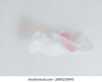  The Subtle Encounter of Color and Texture

 This image captures a delicate, crumpled piece of tissue paper that features a faint pink hue, imbued with a sense of fragility and transient beauty. The simplicity of the composition emphasizes the interplay between the soft texture of the tissue and the gentle color, evoking feelings of vulnerability. The neutral background allows the tissue to stand out, inviting the viewer to contemplate the hidden stories behind seemingly mundane objects. It serves as a reminder of the beauty found in everyday moments.
