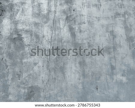 Subtle gray wall showcasing a complex interplay of rough textures and delicate discoloration