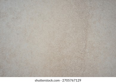 subtle light beige surface background texture with faint grain and mottled appearance concept of ceramic tile, minimalist decor, neutral paper. 