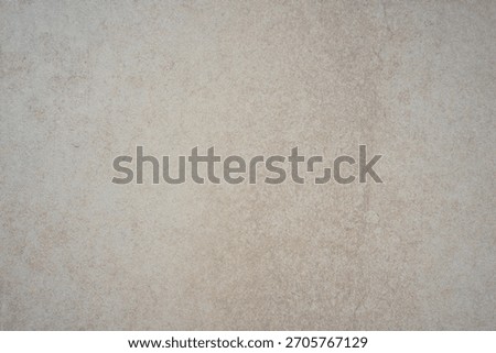subtle light beige surface background texture with faint grain and mottled appearance concept of ceramic tile, minimalist decor, neutral paper. 