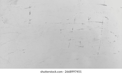 Subtle textured white surface with fine scratches and speckled dust particles. Grunge dust and scratch texture on clean white background. Vintage grunge effect with dust and lines.