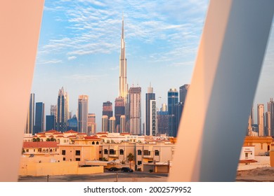 Suburb of Dubai with private residential buildings against the backdrop of a downtown metropolis with skyscrapers and hotels