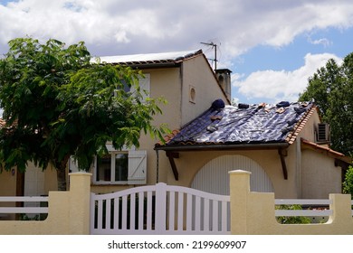 Suburb House After A Huge Hail Storm Rips Through Wrecking Roof Damage With A Temporary Tarpaulin