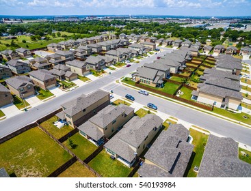 Suburb Housing Community Rows And Houses Aerial Drone View Austin Texas USA Home Development Neighborhood In Summertime Sunshine 