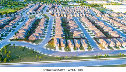 Suburb Housing Neighborhood Homes In Suburbia - Aerial Drone View - Above Austin , Texas , USA Perfect Cubed Square Houses Living Area In Real Estate Suburban Community At Sunset