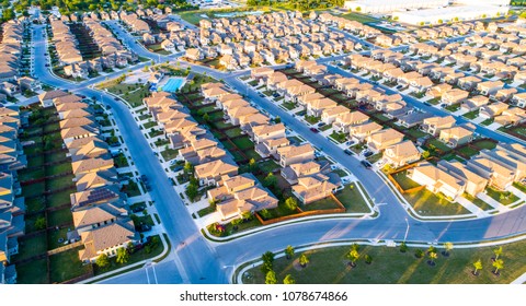 Suburb Housing Neighborhood Homes In Suburbia - Aerial Drone View - Above Austin , Texas , USA Perfect Cubed Square Houses Living Area In Real Estate Suburban Community At Sunset Summer