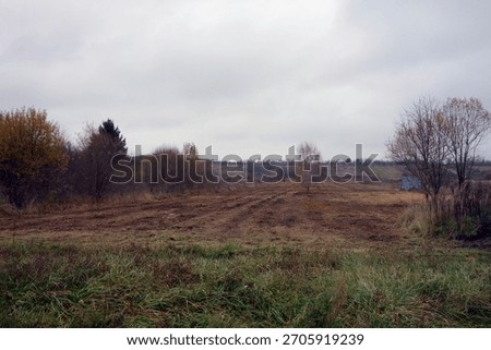 Suburban agricultural plot, built-up terrain.