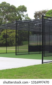 Suburban black cricket nets with a concrete slab in a park. Sydney