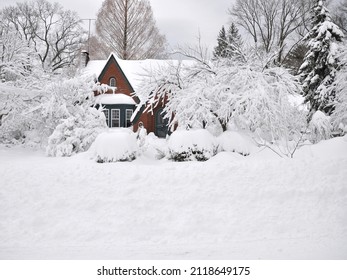 Suburban Brick Home Buried Under Snow After Winter Snowstorm In USA