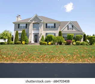 Suburban Brick Home McMansion Style House Blue Sky Cloud USA