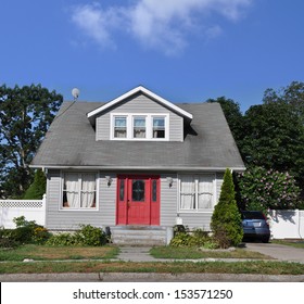 Suburban Bungalow Cottage Style Home Blue Sky Sunny Residential Neighborhood USA