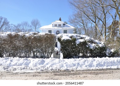 Suburban Cottage Style Single Family Home After Winter Snow Storm Clear Blue Sky