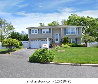 Suburban High Ranch House  Mailbox Front Yard Lawn Sunny Blue Sky Day Residential Neighborhood