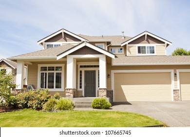 Suburban Home With Front Porch,garage And Blue Sky